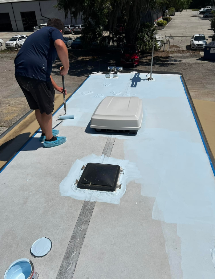 RV roof sealant application on rubber roof membrane